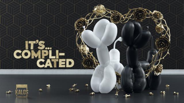 Two balloon dogs stand in rose arch